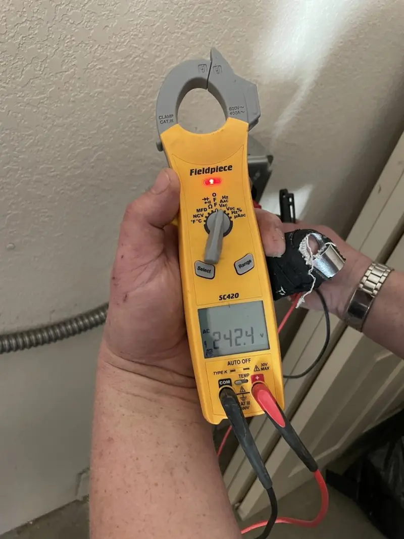 Voltage testing with clamp meter during Circuit Breaker Repair in Dimmitt
